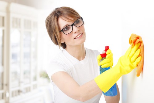 Professional carpet cleaner following safety procedures in West Brompton