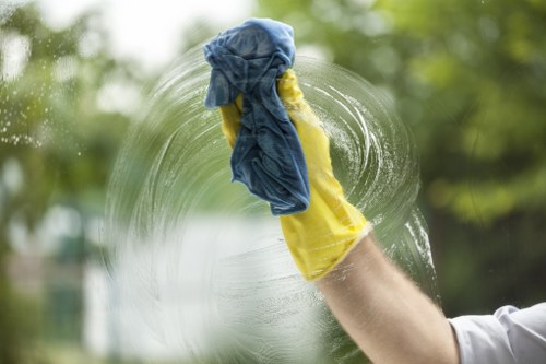Cleaner preparing a work area while following health and safety procedures